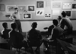 industrial design studio crit circa 1970 black and white historical photo